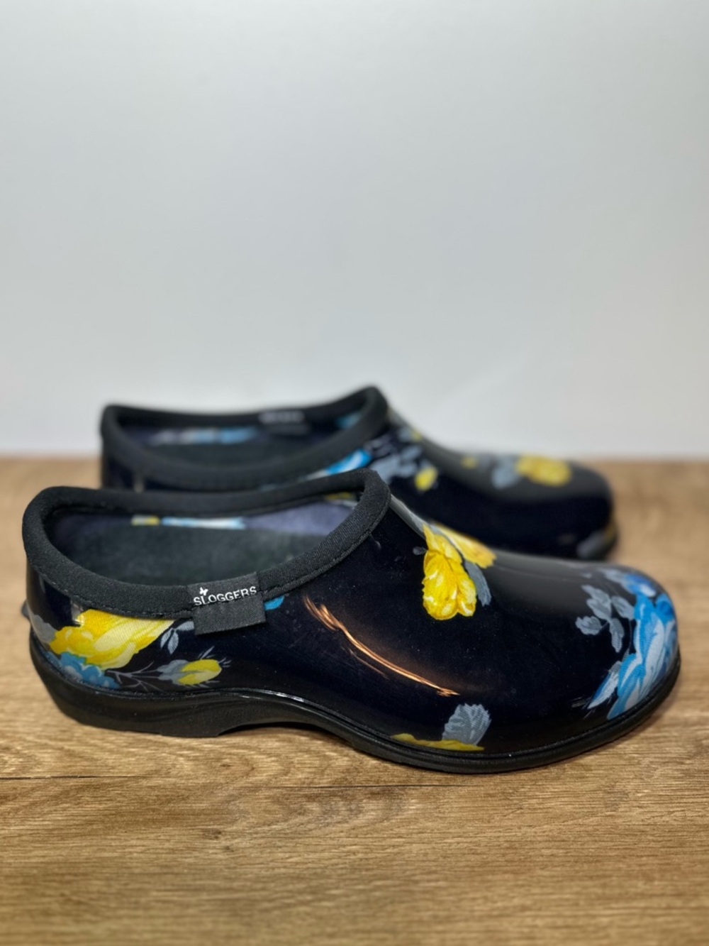 Sloggers Women's Black Slip-On Floral Clogs with Yellow & Blue Accents size 9